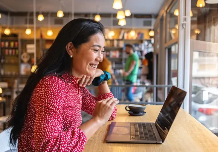 Happy woman working in a coffee shop